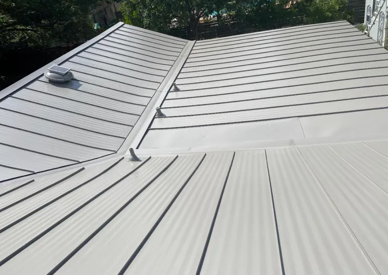 Solar attic fan installed on a metal roof for Roof Ventilation in Sherrelwood